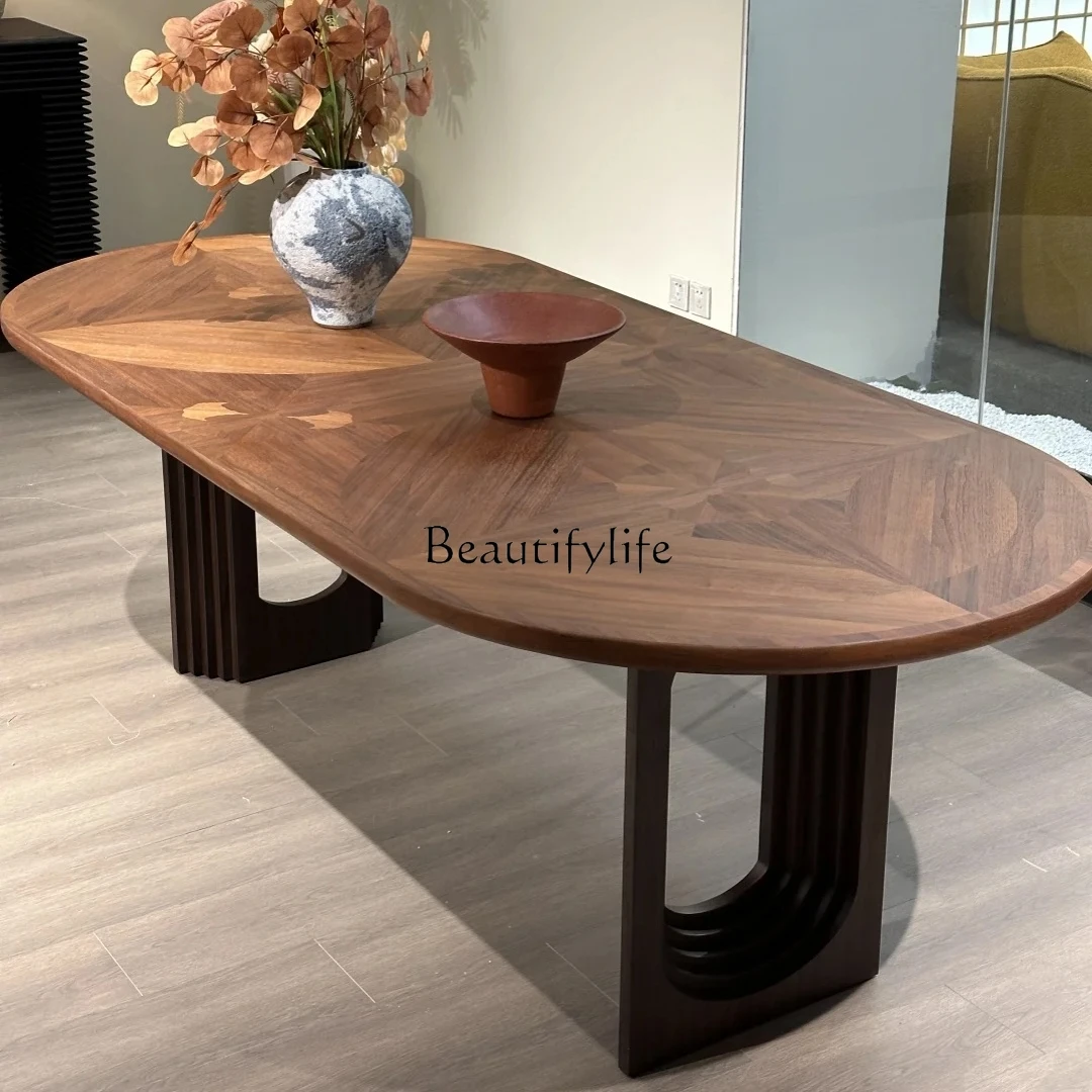

Black walnut wabi wind solid wood dining table designer simple negotiation oval table workbench