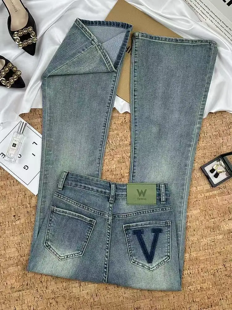 جينز جميل عالي الجودة للنساء بمزاج ربيعي عالي الخصر للتخسيس متعدد الاستخدامات سروال غير رسمي للمكتب للسيدات من قماش الدنيم