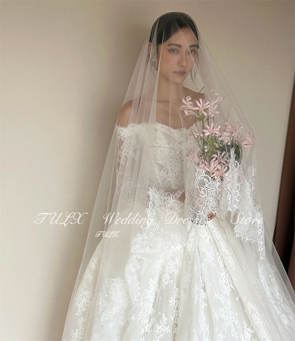 ชุดแต่งงานลูกไม้สีงาช้างหรูหรา TULX สไตล์เกาหลี ถ่ายรูป ชุดเจ้าสาวแขนยาวเปิดไหล่ คอร์เซ็ทสั่งตัดได้ 웨딩드레스