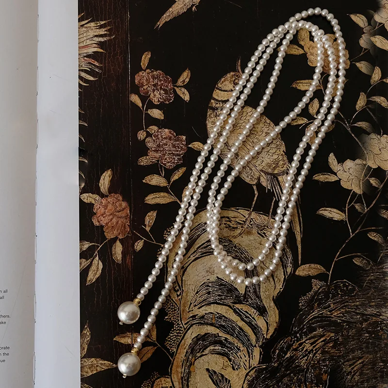 

Универсальное длинное жемчужное ожерелье для женщин, многослойное многослойное стильное элегантное легкое роскошное аксессуар, цепочка для свитера, поясная цепочка