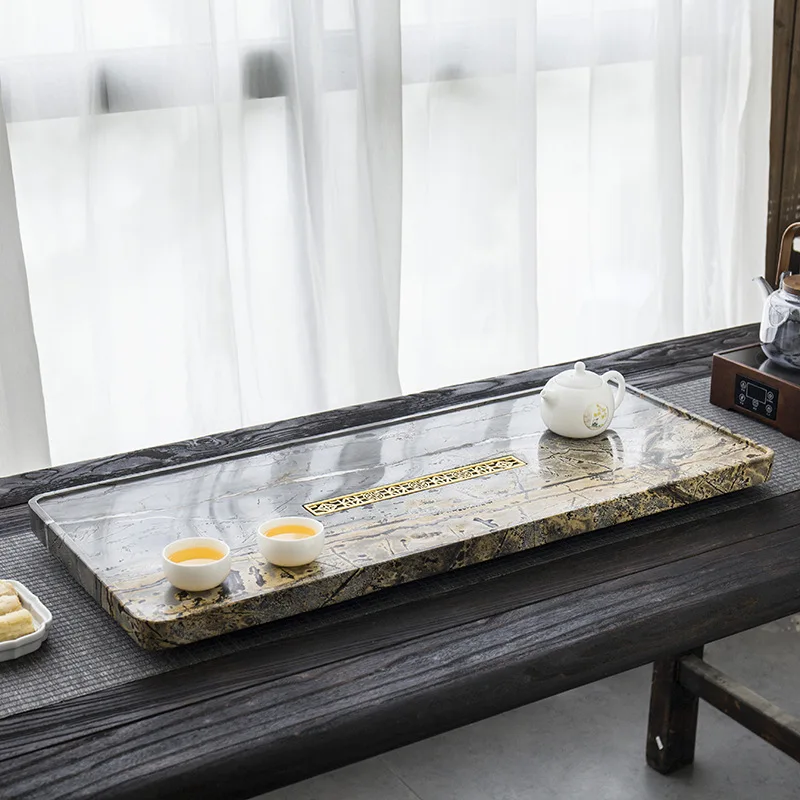 A traditional stone tea tray with a whole high-end rough stone, one piece of black gold