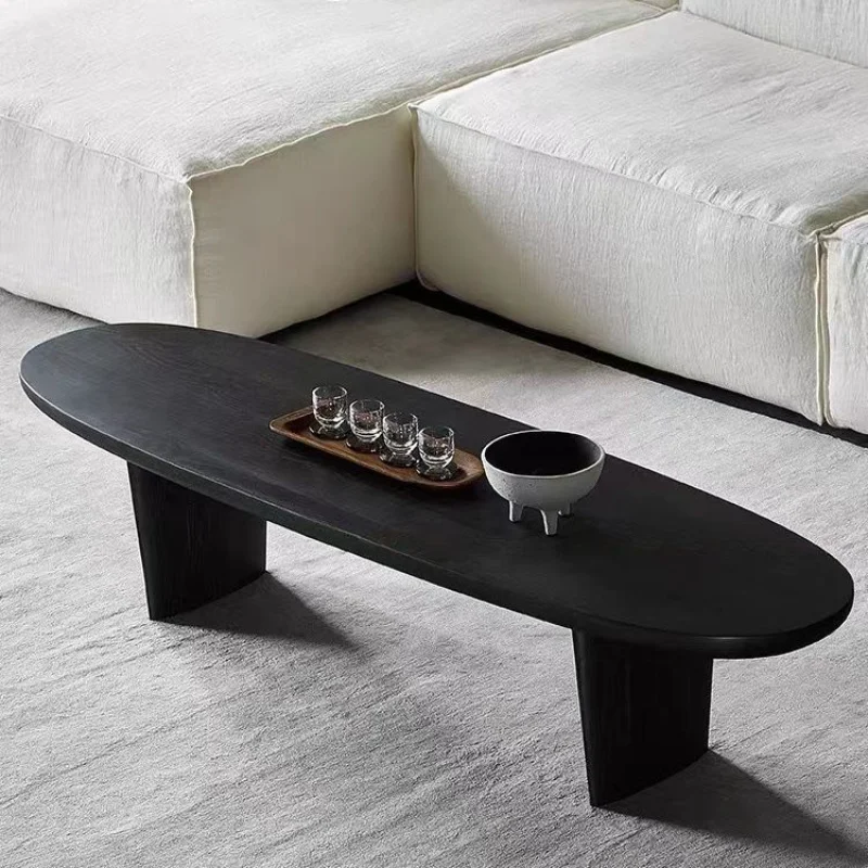 Nordic designer solid wood coffee table wabi-sabi wind black oval small tea table simple medieval bed and breakfast log table
