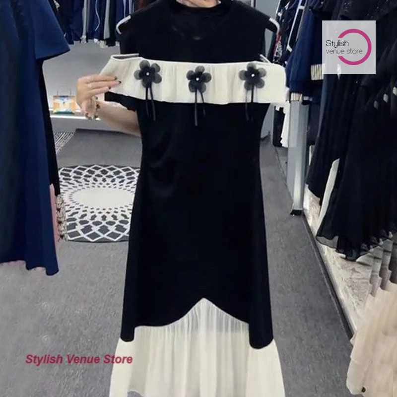 

French fashion off-the-shoulder dress female summer new temperament casual design sense stitching slim waist split long skirt.