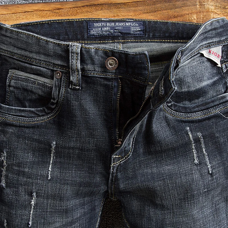 Włoski styl modne dżinsy męskie Retro czarny niebieski elastyczny Slim Fit postrzępione porwane jeansy męskie Vintage Designer spodnie dżinsowe Hombre