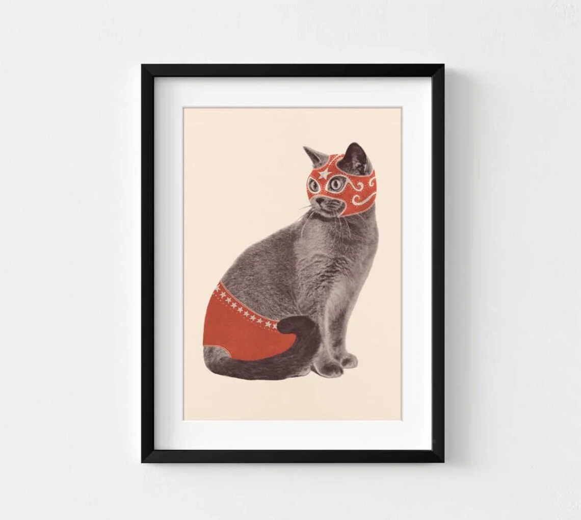 Whimsical Lucha Libre Cat Wall Art - Playful Contrast of a Sophisticated Grey Cat in a Bold Red Wrestler Outfit, Retro Aesthetic