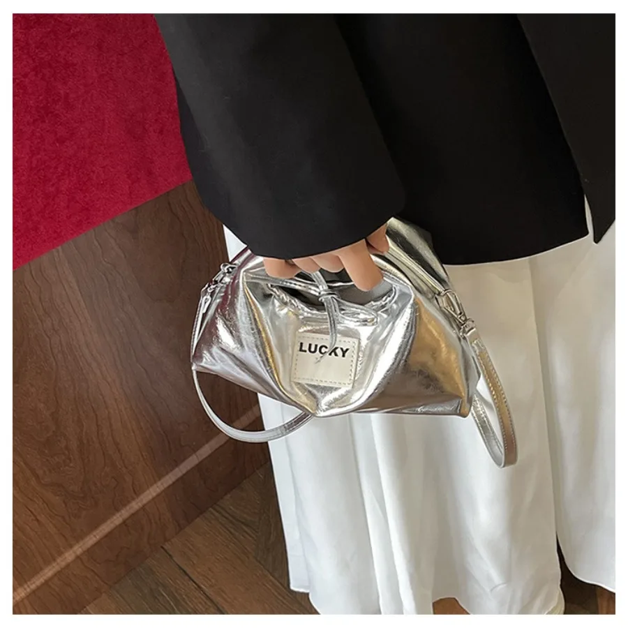 

Fashionable casual unique niche simple versatile and stylish handheld dumpling bag commuting texture crossbody women's bag