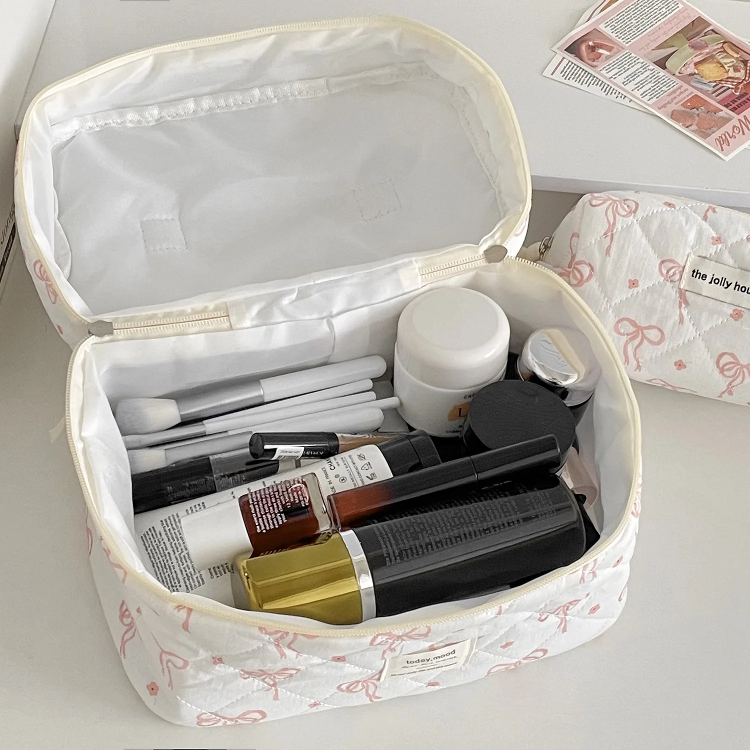 Borsa per trucco trapuntata da donna con fiocco alla moda Borsa portatile per cosmetici da toilette Borsa per fiori Borse con cerniera