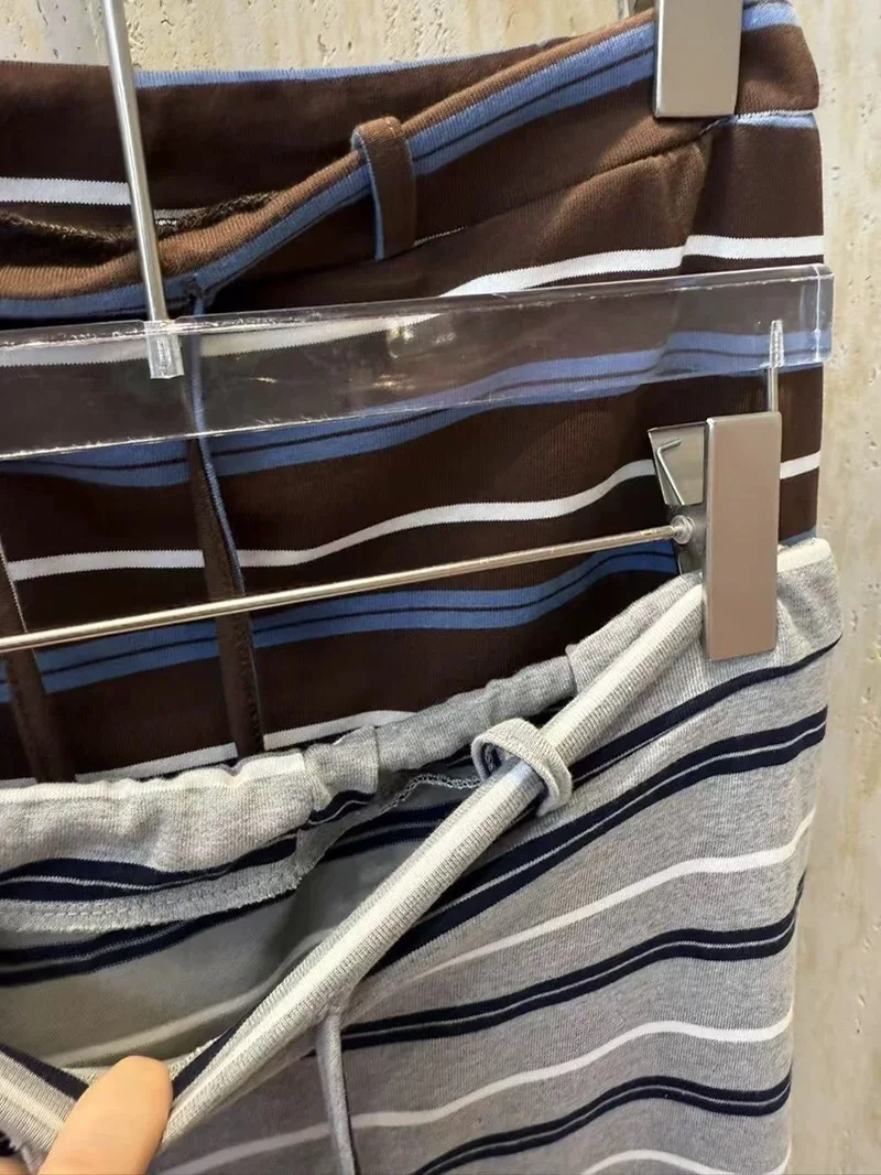 تنورة قصيرة كورية مخططة بألوان متباينة برباط على شكل حرف a للنساء صيفية فضفاضة للتخسيس تنانير طويلة غير رسمية