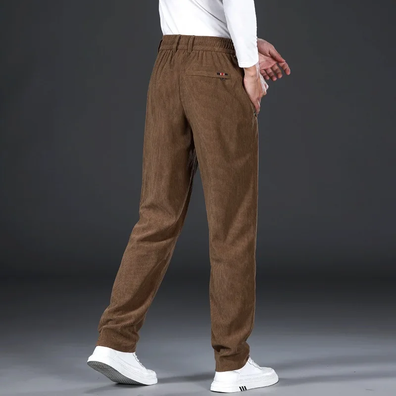 Pantalones informales gruesos de otoño e invierno para hombre con cintura elástica a rayas y pantalones de pierna ancha, pantalones de pierna recta sueltos de pana