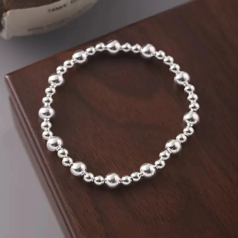 สร้อยข้อมือเงินแท้ 925 ประดับลูกปัดทรงกลม ของขวัญวันเกิด เครื่องประดับเงิน สร้อยข้อมือแบบยืดได้ รุ่นใหม่