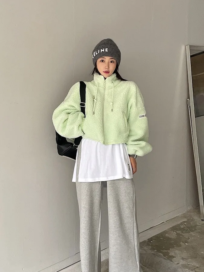 หลวม U-Ne สีขาวฐานเสื้อยืดผู้หญิง ular Design Sense Slit ป้ายความยาวกลางอินเทรนด์สําหรับฤดูใบไม้ร่วงฤดูหนาว