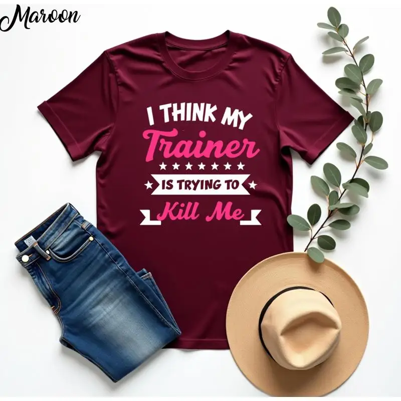 

I Think My Trainer Is Trying To Kill Me T Shirt Funny Gym Workout Hilarious Fitness EnthusiasT Personal Joke