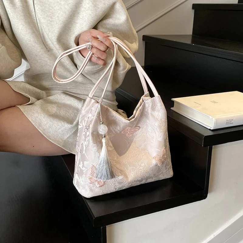 Bolso de mano de cuero de diseñador famoso para mujer, bolso de viaje elegante con detalles clásicos a la moda de marca de lujo ​