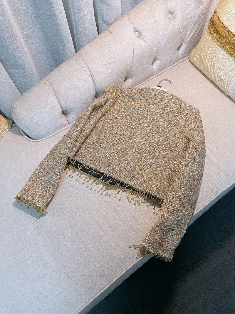   เสื้อโค้ทขนเฟอร์เทียมแบบไม่มีลายเย็บติดกัน พร้อมพู่ห้อย สไตล์ฝรั่งเศส ทรงเข้ารูปสำหรับผู้หญิง เสื้อคลุมฤดูใบไม้ร่วง ทำจากเส้นใยโพลีเอสเตอร์