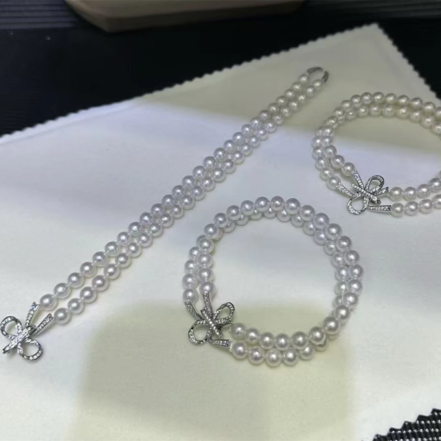 

Bow Double Row AAA7-8mm Natural White Pearl Necklace Bracelet 7.5-8in