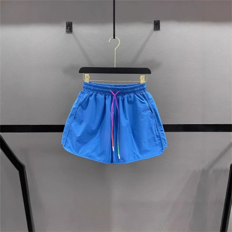 2025 Nuevos pantalones cortos de pierna ancha con cordón de color caramelo transpirable de algodón de verano para mujer