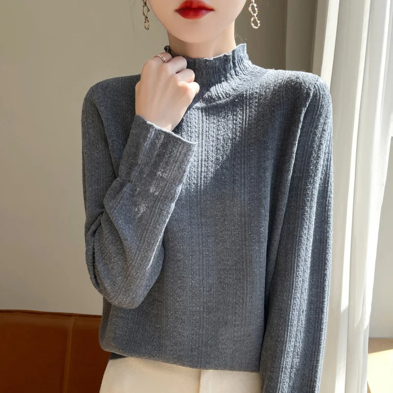 Autumn and winter new 100% pure wool women\'s semi-high-necked wood ear hollow long-sleeved knitted loose bottoming shirt sweater