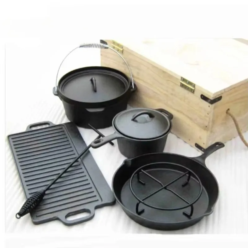 

Cast iron Dutch pot with campfire tripod for outdoor cooking