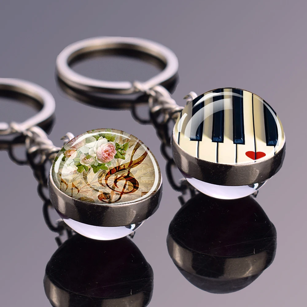 Llaveros de instrumento Musical, llavero colgante de bola de cristal de doble cara, nota Musical, Piano, guitarra, clarinete, flauta, regalo artístico