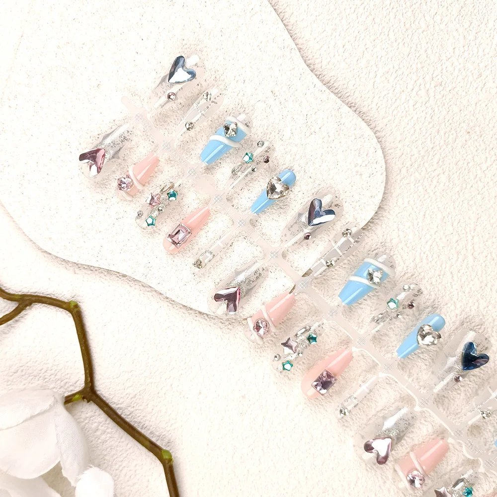 Blue star-themed nail art, heart-shaped rhinestone nail stickers for a sophisticated look.