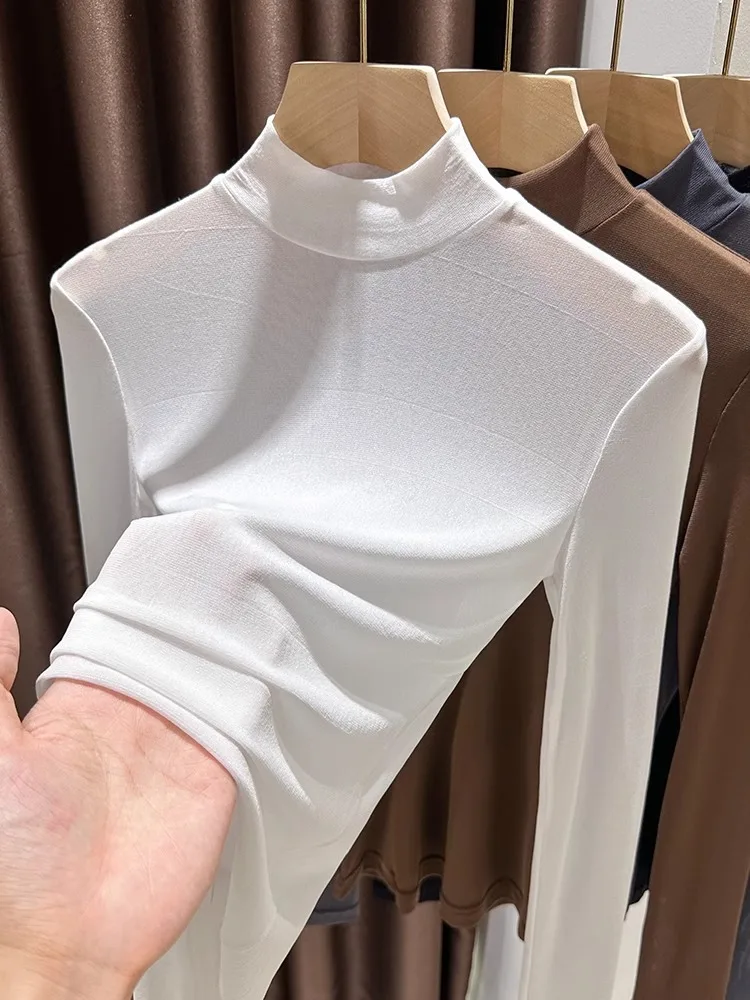 Przezroczysta, cienka, długa bluzka z wysokim kołnierzem, bazowa, damska, wiosenno-jesienna, koronkowa, elegancka, do pracy.