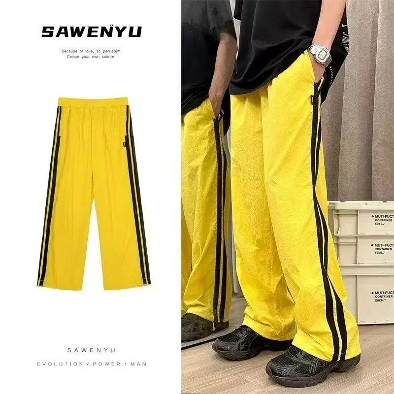 

American retro dopamine yellow striped sports quick-drying pants for men and women couples loose casual versatile work pants