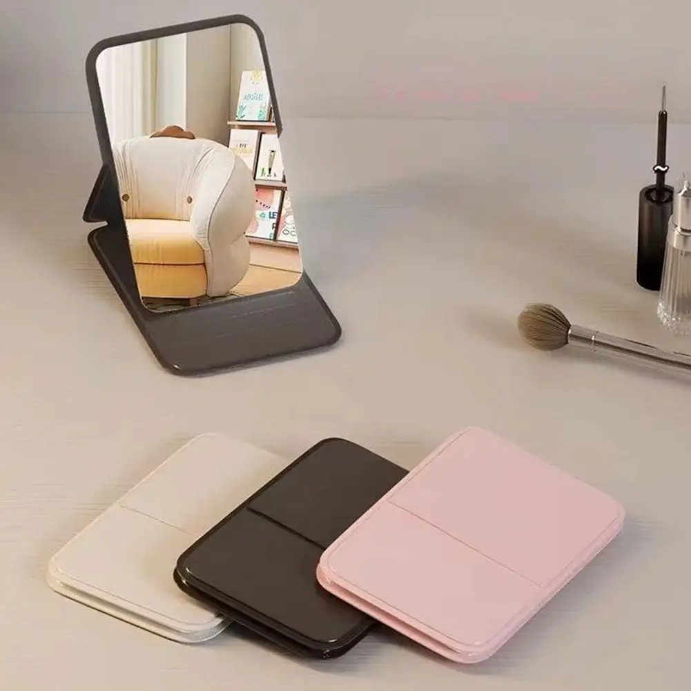Espejo de maquillaje plegable de alta calidad, espejo de maquillaje portátil, espejos de maquillaje de pie de escritorio de Color sólido creativos de un solo lado para mujer