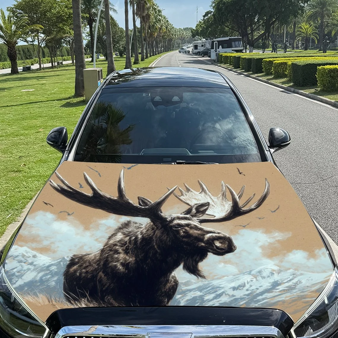 Car hood cover featuring a majestic moose against a snowy mountain backdrop, perfect for nature lovers.Hood Wrap, Car Hood Decal