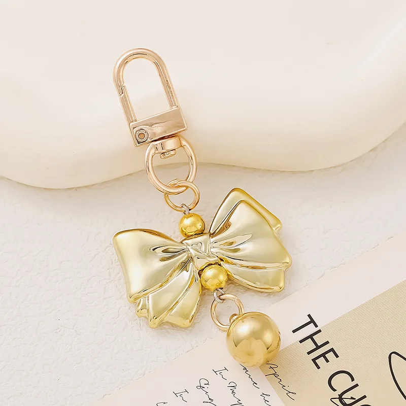 

New creative and personalized pearl bow pendant bag, phone case, keychain pendant