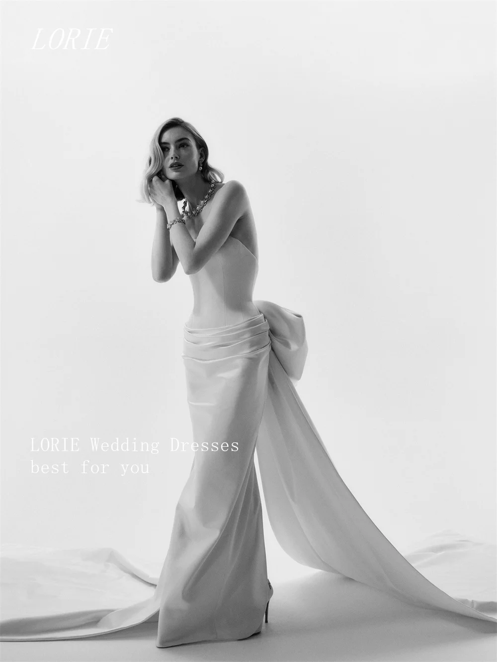 LORIE Luxus-Bogen-Meerjungfrau-Hochzeitskleid, schlichtes trägerloses Brautkleid, ärmelloses Falten-Hochzeitskleid, individuell gestaltet 2026