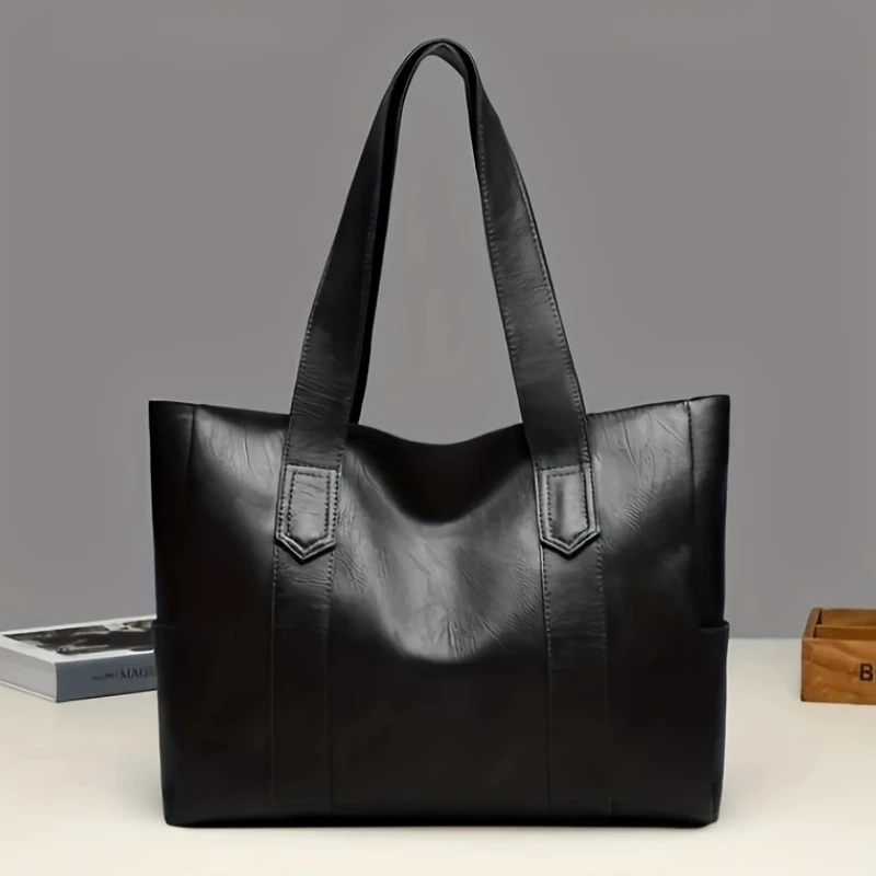 

This lady's large-capacity handbag features elegant golden metal fittings and a firm zipper seal. The inner lining is dark brown