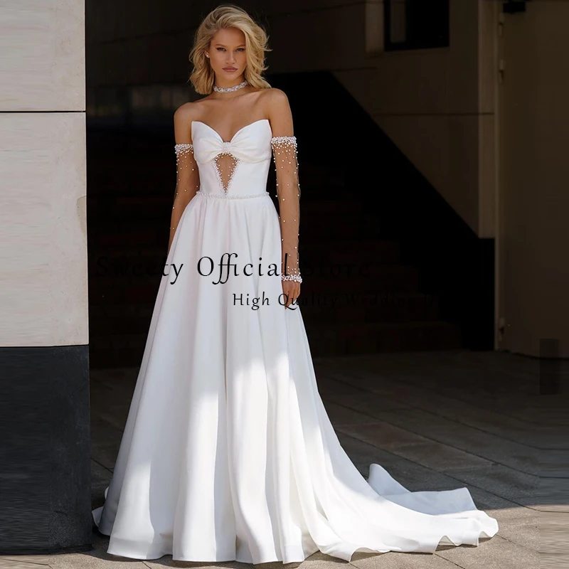 فستان زفاف مكشوف الكتفين من الساتان مع فيونكة لؤلؤ على شكل حرف a بدون حمالات وأكمام طويلة فستان عروس مخصص فيستدو دي نوفيا