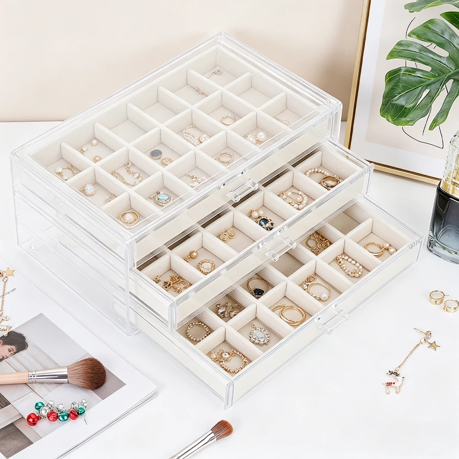 

A three-layer, 54-slot beige jewelry storage box, suitable for storing rings, earrings and necklaces, as well as for placing on
