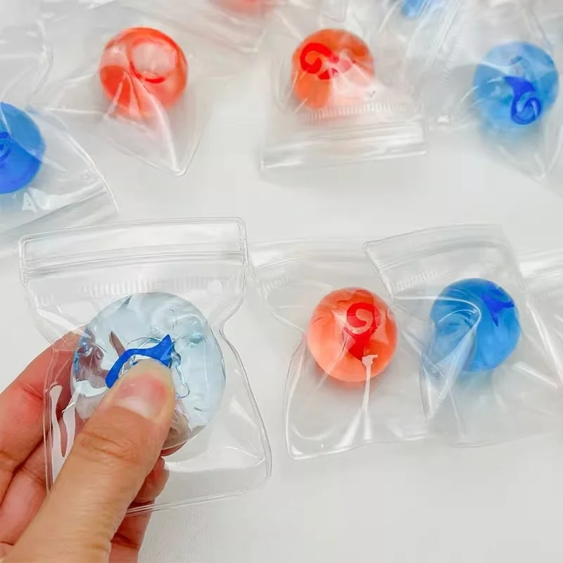 2 Stück neue Squishy Tabas Stressball Cartoon Animation Clear Mini TPR Soft Sticky Bag Ball Squeeze Fidget Kinderspielzeug Urlaubsgeschenke