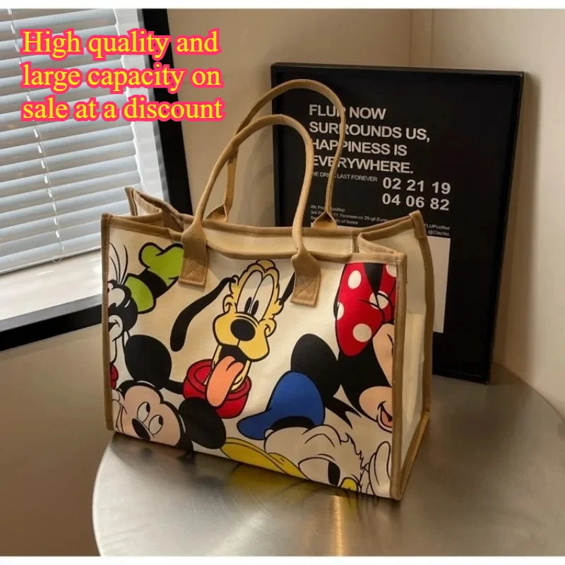 กระเป๋าผ้าแคนวาสลายการ์ตูนมิกกี้เมาส์น่ารัก ปี 2025 กระเป๋าสะพายไหล่ใบใหญ่จุของได้เยอะ กระเป๋าโท้ทแฟชั่นสำหรับผู้หญิง กระเป๋าคุณแม่ กระเป๋าเดินทางพักผ่อน