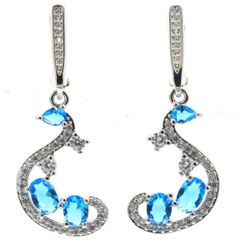 

Купите 5, получите 1 бесплатно: Серебряные серьги с натуральными зелеными изумрудами, красными рубинами, синими топазами, цитринами, мистическими топазами и фианитами, 38x14 мм, 4,5 г.