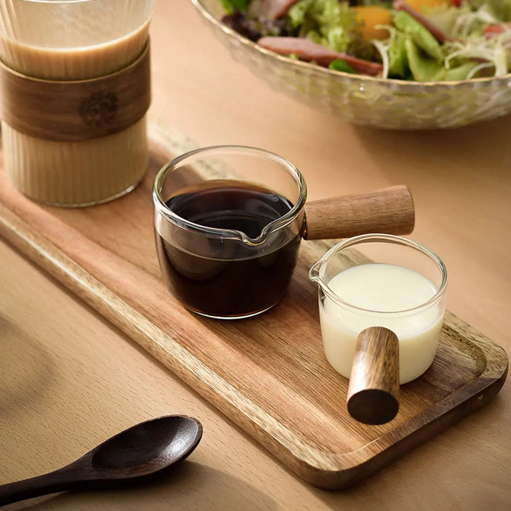 

2Pcs Glass Milk Pitcher Set Wooden Handle Clear Glass Cream Pitcher for Coffee Shop Restaurant Hot Syrup Serving