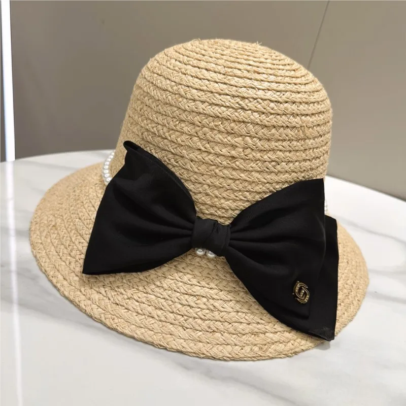 

black and white grass hat