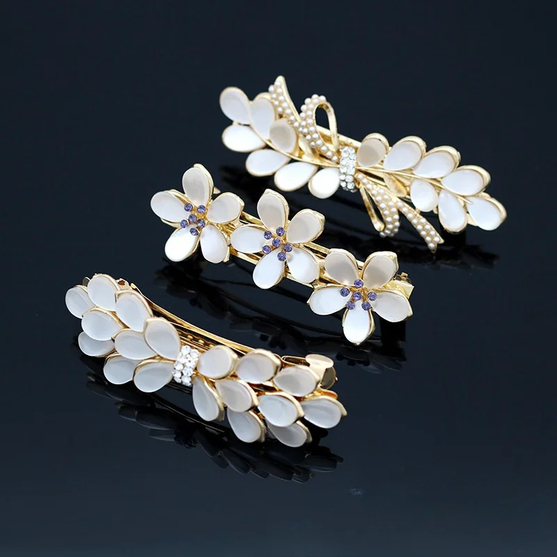 New Korean White Cat's Eye Zircon Spring Hair Clip Pearl Bowknot Boutique Alloy Top Clip Elegant Women's Fashion Hair Jewelry