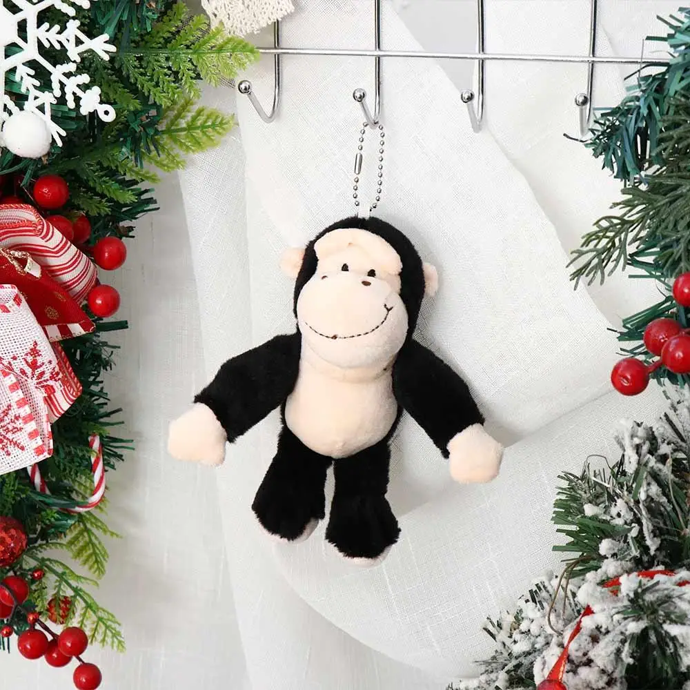 الحيوانات المحشوة سلسلة المفاتيح القرد أفخم دمية لينة الفراء قرد حلقة رئيسية حامل المفاتيح Kawaii Orangutan ألعاب من نسيج مخملي على ظهره الديكور