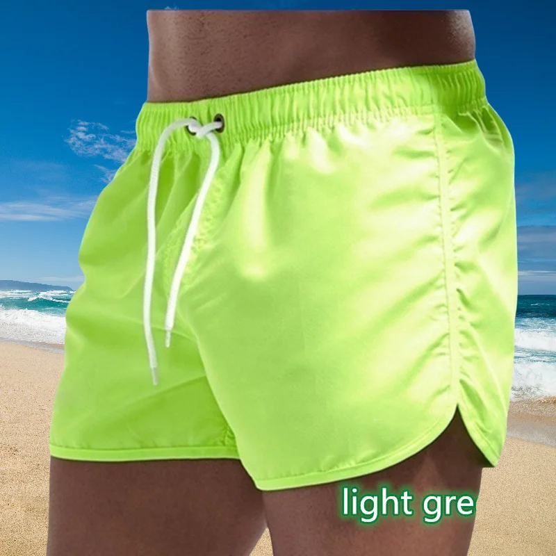 Pantaloni da bagno da uomo con tasche laterali in rete, pantaloncini da spiaggia in tinta unita, asciugatura rapida, pantaloncini leggeri con coulisse, costume da bagno estivo