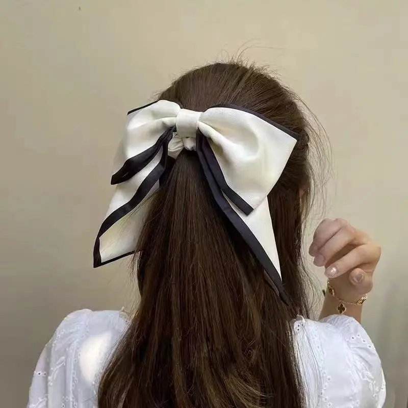 

Black big bow hair ring summer cool high-end feeling on the back of the head tied with low ponytail hair ring headdress