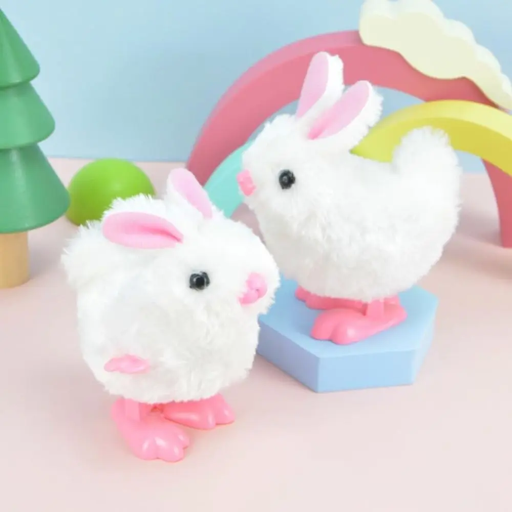 Nuevo Conejo de peluche blanco, juguete interactivo de cuerda con mecanismo de relojería, juguete para saltar de Pascua para niños