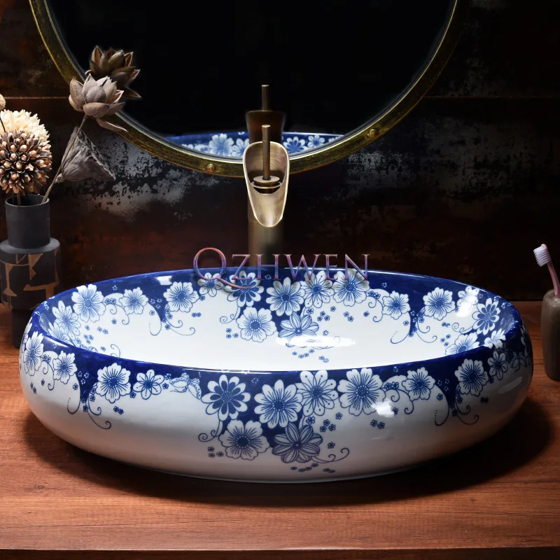 China Blue and White Porcelain Ceramic Washbasin Oval Sink Bathroom Easy Clean Balcony Countertop Art Basin with Tap 60*40*14cm