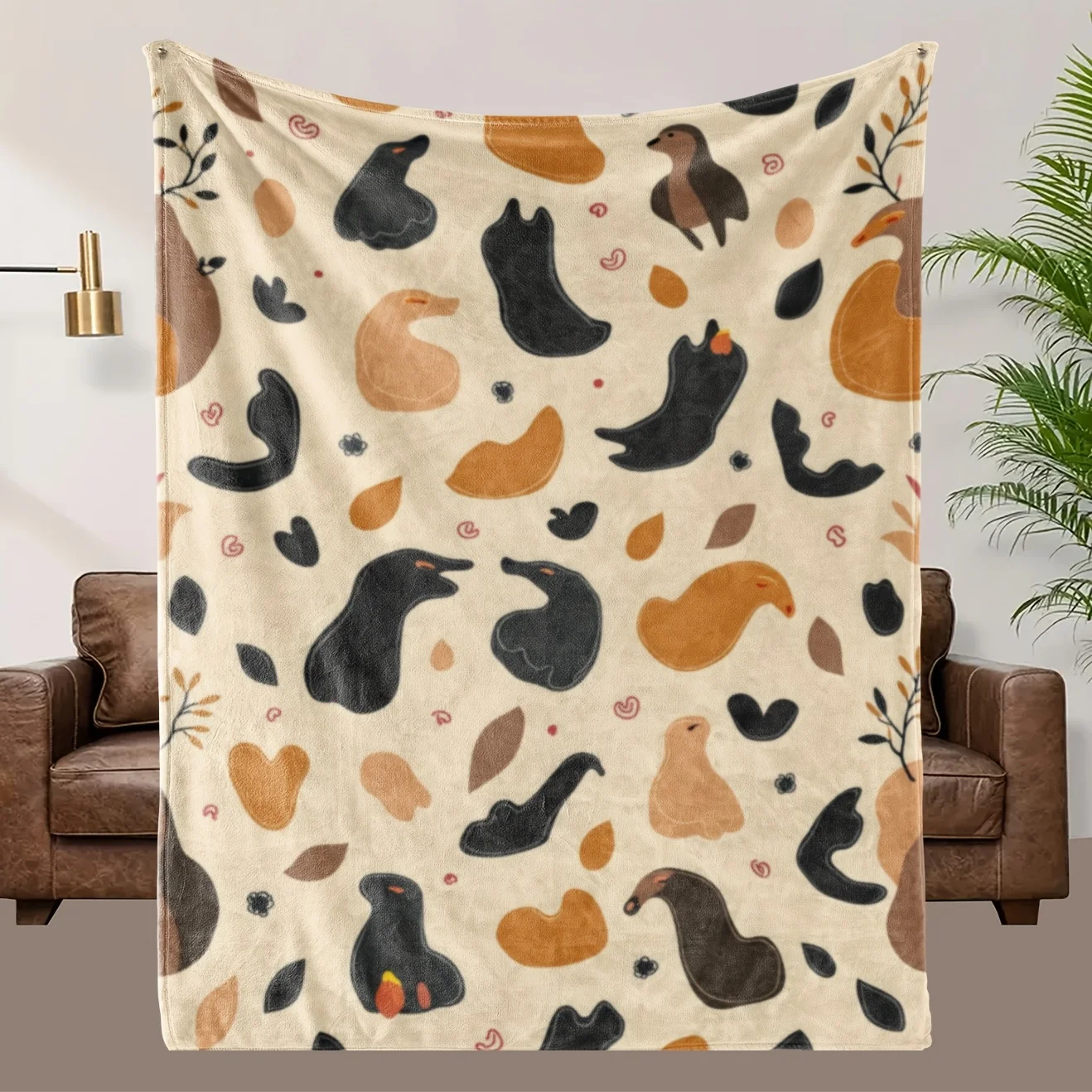 

Плед с рисунком коричневых и оранжевых уток, изготовленный из полиэстера, подходит для декора спальни и гостиной.