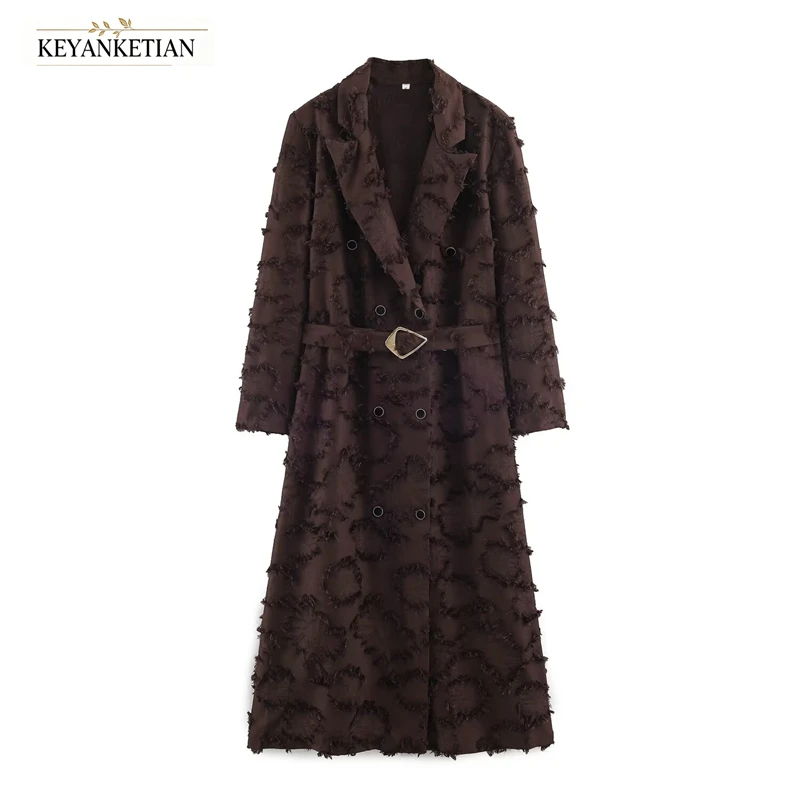 KEYANKETIAN 2026 Elegant Jacquard Long Outerwear Lapel Neck Double Breasted Triangle Buckle Belt Waist‑Fitted Women Trench Coat