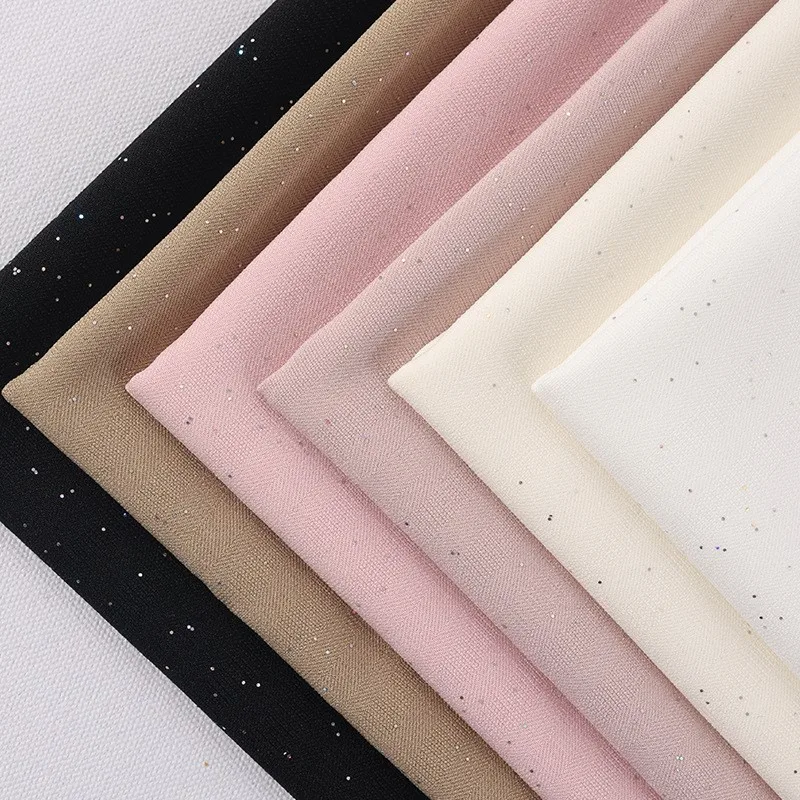 

New fashionable and elegant sequined women's suit fabric designed by a clothing designer