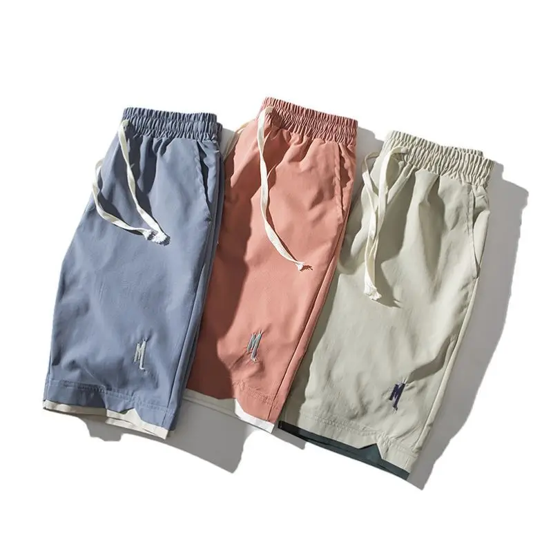 Pantaloni ort sottili in seta di ghiaccio estiva da uomo nuovi Pantaloni larghi a cinque punti larghi per sport da spiaggia casual leggeri