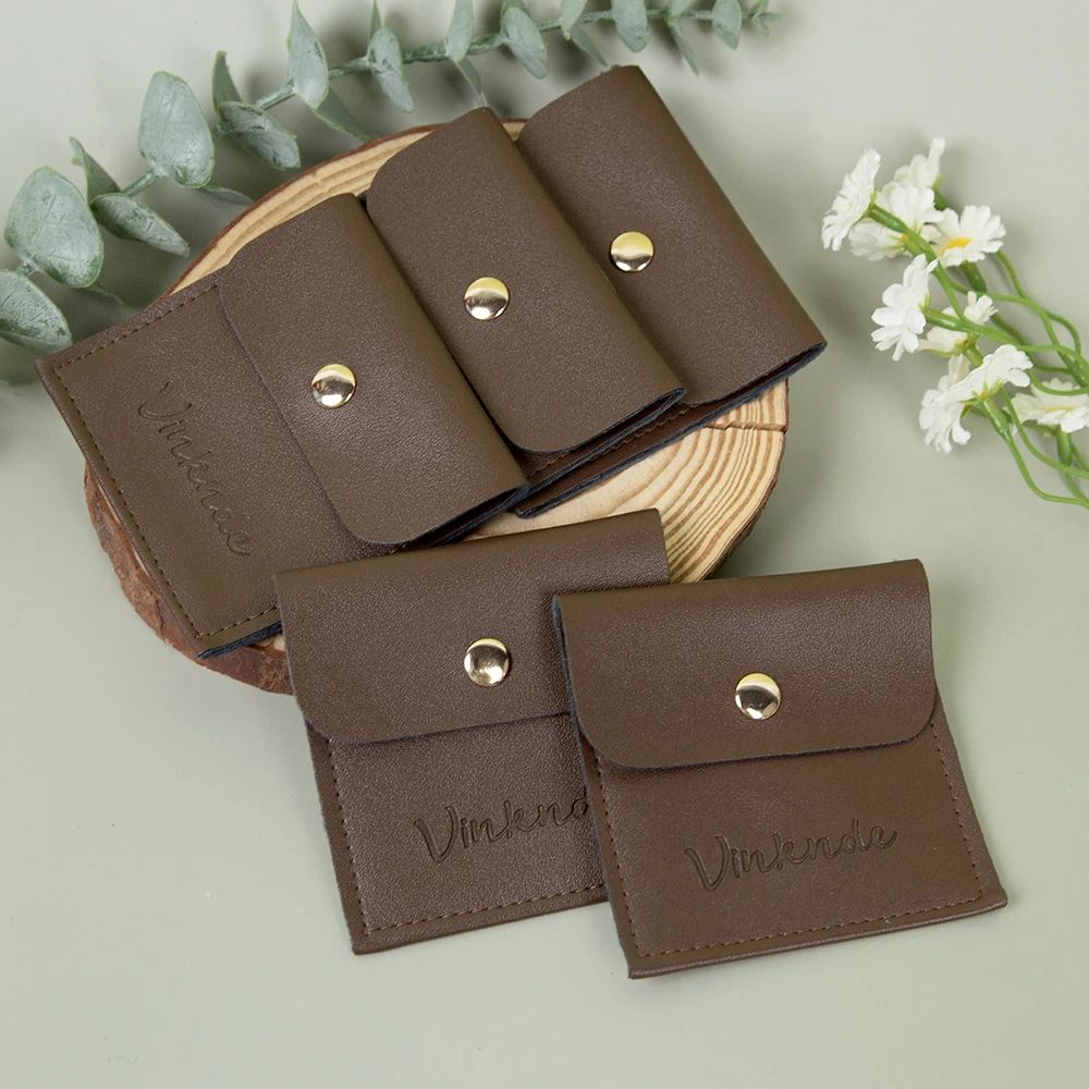 

Custom Black Brown PU Leather Jewelry Bag with Logo High Quality Snap Button Earrings Rings Makeup Watch Travel Storage Pouch