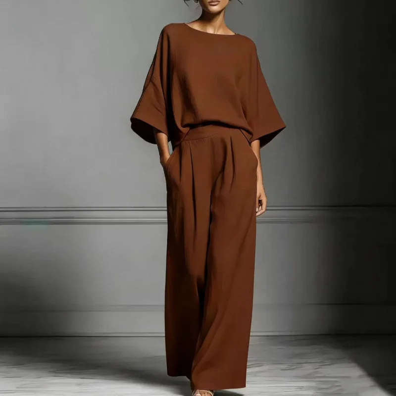 

Новинка 2026: Весенне-летний женский комплект из однотонного свободного топа с круглым вырезом и широких брюк. Модный повседневный костюм для создания элегантного образа.